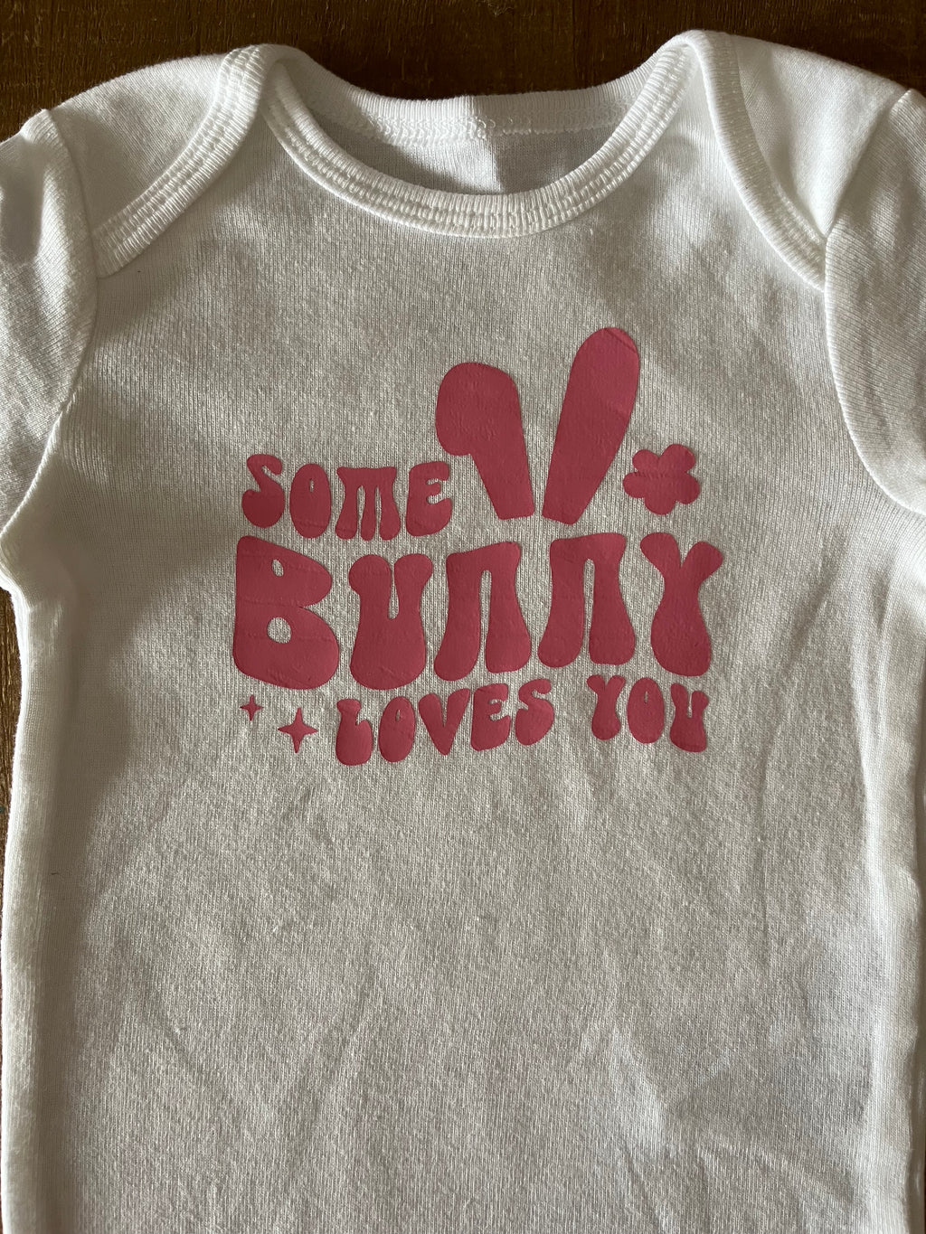 Some Bunny Loves You Pink Baby Bodysuit